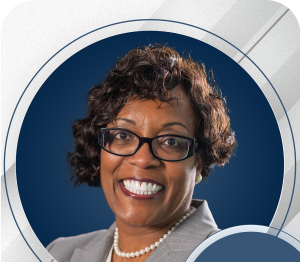 Janet in professional setting, smiling.